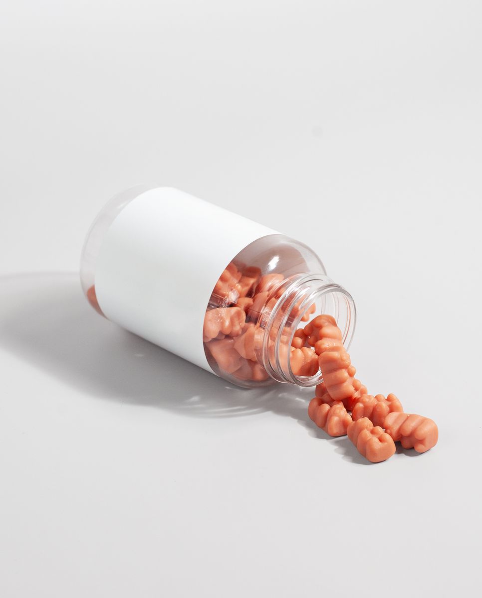A jar of colorful gummies that look like candy